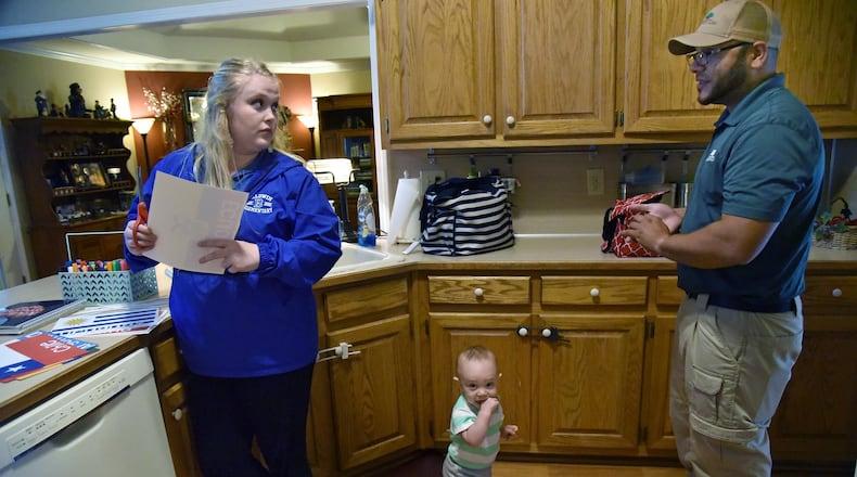 Audrey Smith cuts out some of her teaching materials as Jose Velez looks after their 11-month-old son Timothy at their home in Dacula on Friday, May 5. On the first day of this school year, first-year teacher Audrey Smith let us shadow her through that day, which included learning the names of her students, attempting to teach them how to behave and nearly forgetting to get one student on the school bus at the end of the day. As the school year ends, we check in with Smith, who has learned a lot about the teaching profession, parenting and herself by being a teacher. She quickly learned one big reason why teachers leave the profession: money. Smith, mother of a newborn son, lives with her parents and her boyfriend. Without her family’s financial support, Smith says she wouldn’t make it as a teacher. HYOSUB SHIN / HSHIN@AJC.COM