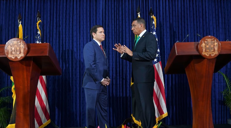 FILE - U.S. Secretary of State Marco Rubio, left, and Jamaica's Prime Minister Andrew Holness speak after giving a joint news conference at the office of the prime minister in Kingston, Jamaica, March 26, 2025. (Nathan Howard/Pool Photo via AP, File)