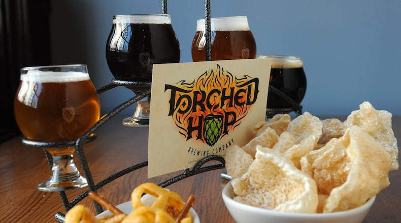 Torched Hop Brewing Co. duck fat chef mix and salt and vinegar pork rinds with a flight of beers: Belgian Golden, Scottish Ale, IPA and Milk Stout. (Beckysteinphotography.com)