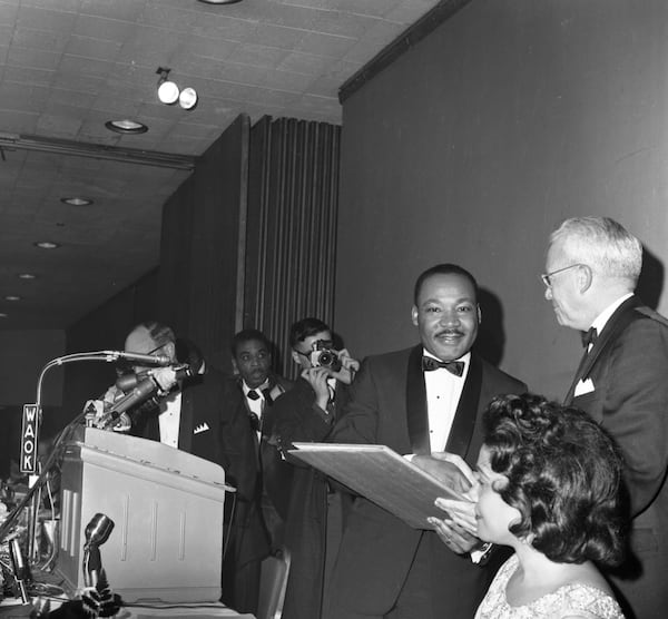 Martin Luther King, Jr. shakes hands with Atlanta Mayor Ivan Allen Jr. at his Nobel Peace Prize recognition dinner, National Conference of Christians and Jews, Dinkler Plaza Hotel, Atlanta, Georgia, January 27, 1965. LBSCB12-120d, Lane Brothers Commercial Photographers Photographic Collection, 1920-1976. Special Collections and Archives, Georgia State University Library.