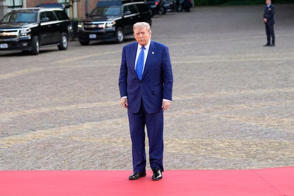President Donald Trump poses for photographers as he arrives for a formal dinner at the Paleis Huis ten Bosch ahead of the NATO summit in The Hague, Netherlands, Tuesday, June 24, 2025. (AP Photo/Alex Brandon)