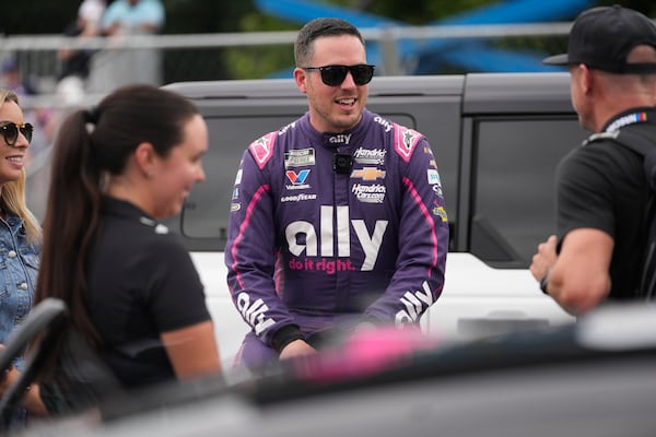 Driver Alex Bowman (48) talks with people before in a NASCAR Cup Series auto race at the Grant Park 220, Sunday, July 6, 2025, in Chicago. (AP Photo/Erin Hooley)