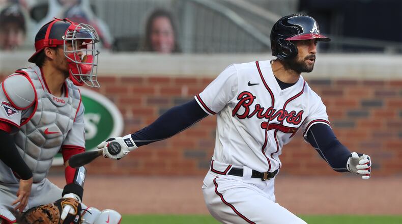 081720 Atlanta: — MARKAKIS DOUBLE —Atlanta Braves outfielder Nick Markakis rips a double to score Marcell Ozuna with Washington Nationals catcher Kurt Suzuki looking on during the second inning in a MLB baseball game on Monday, August 17, 2020 in Atlanta.    Curtis Compton ccompton@ajc.com