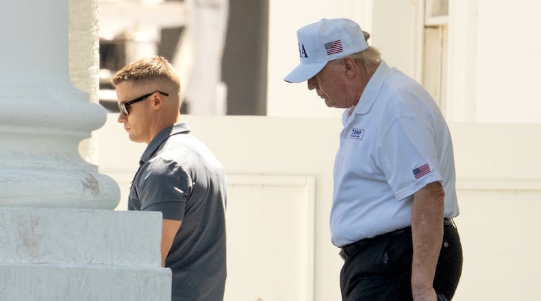 President Donald Trump walks to board his limousine at the North Portico of the White House, Saturday, June 13, 2026, in Washington. (AP Photo/Mark Schiefelbein)
