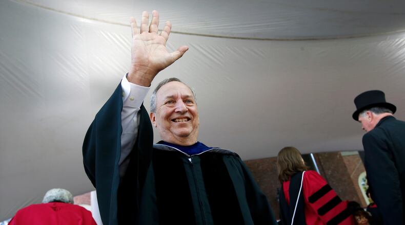 FILE -Former Harvard University president Larry Summers waves during Harvard commencement exercises, May 24, 2018, in Cambridge, Mass. (AP Photo/Michael Dwyer, File)