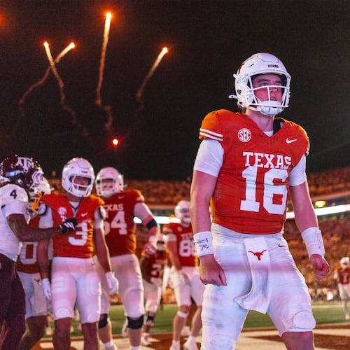 Texas quarterback Arch Manning (16) celebrated a touchdown against Texas A&M during the second half of an NCAA college football game Friday, Nov. 28, 2025, in Austin, Texas. (AP Photo/Stephen Spillman)