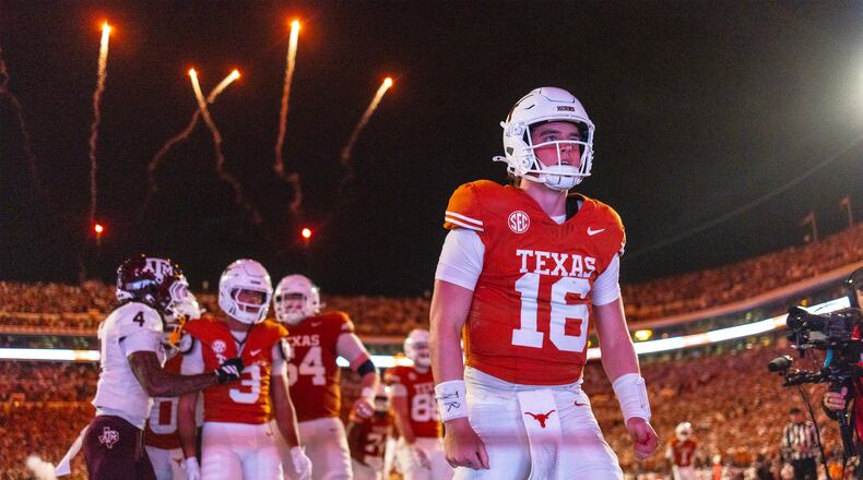 Texas quarterback Arch Manning (16) celebrated a touchdown against Texas A&M during the second half of an NCAA college football game Friday, Nov. 28, 2025, in Austin, Texas. (AP Photo/Stephen Spillman)