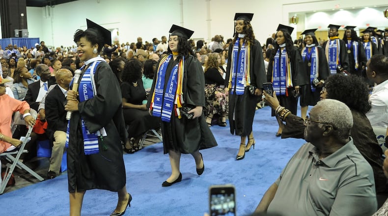 Erica Lamberson leads a group of woman entering the Spelman College commencement ceremony, Sunday, May 17, 2015, at the Georgia International Convention Center in Atlanta. Spelman ranked 6th among the 50 best colleges for African Americans, in a new ranking from Essence and MONEY magazines.(Special/John Amis)