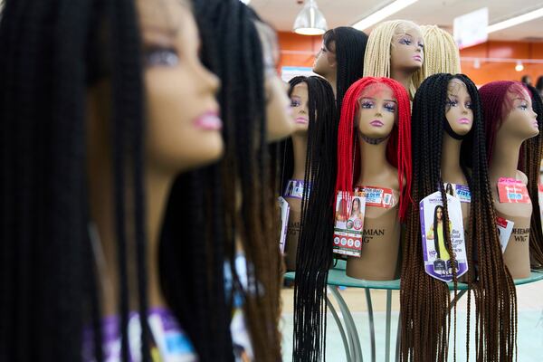 Braided wigs are seen on display at Chapel Beauty, a beauty supply store in Decatur, Ga., Monday, May 5, 2025. (AP Photo/Stephanie Scarbrough)