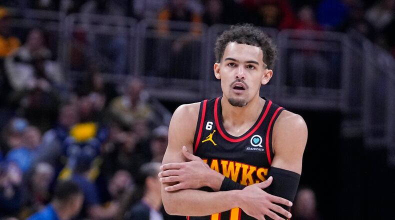 Atlanta Hawks' Trae Young reacts after hitting a shot against the Indiana Pacers during the second half of an NBA basketball game Friday, Jan. 13, 2023, in Indianapolis. (AP Photo/Darron Cummings)