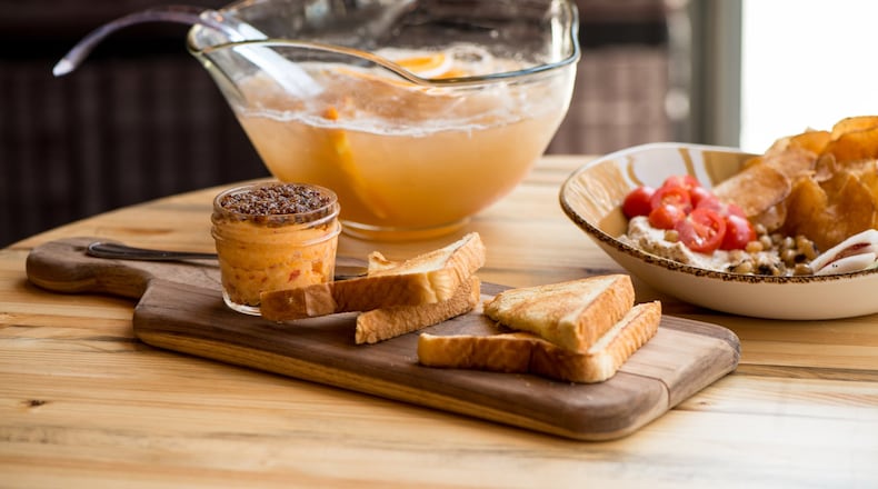 Punch Bowl Social Hugh's Pimiento Cheese with "Tender Belly" bacon marmalade and Pullman toast. Photo credit- Mia Yakel.