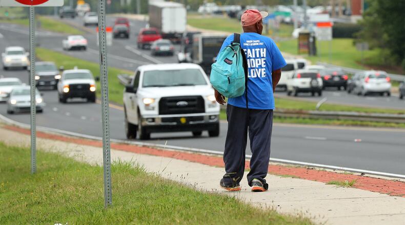 A homeless man makes his way down Cobb Parkway near Bells Ferry Road in Marietta. A panel of lawmakers and other interesed parties are sending a list of recommendations to the Georgia Senate to help the state tackle homelessness. Curtis Compton/ccompton@ajc.com