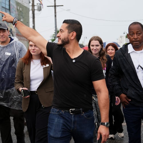 Abdul El-Sayed, a progressive candidate in the Democratic primary for U.S. Senate in Michigan, walks from Anthology Coffee to the Spirit of Detroit during the March of the Many, Sunday, Aug. 2, 2026, in Detroit. (AP Photo/Julia Demaree Nikhinson)