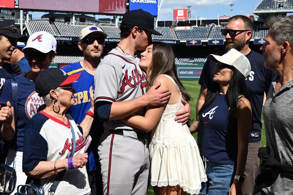 Braves pitcher JR Ritchie hugs fiancee Makena Miller after winning his MLB debut at Truist Park. (Nick Wass/AP)