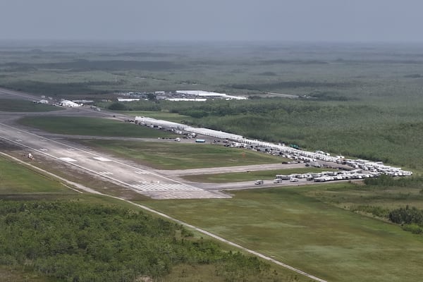 FILE - This aerial photo shows heavy-duty tents, trailers and other temporary buildings being built by the state for an immigration detention facility at the Miami Dade County-owned airfield in the Big Cypress National Preserve, about 45 miles west of downtown Miami, June 27, 2025. (AP Photo/Daniel Kozin, File)