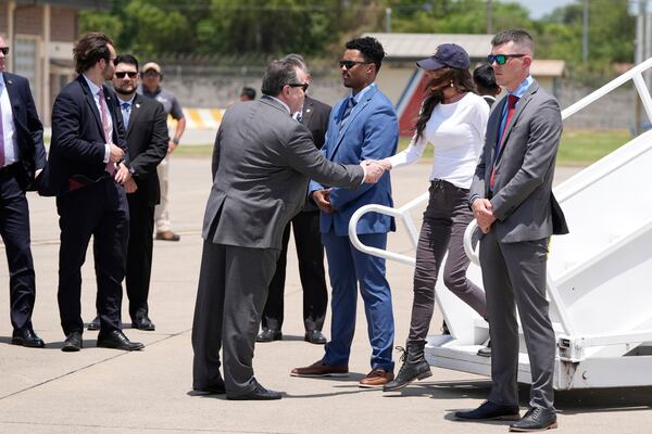 U.S Ambassador William H. Duncan receives Homeland Security Secretary Kristi Noem as she deplanes at the Comalapa International Airport, in San Salvador, El Salvador, Wednesday, March 26, 2025. (AP Photo/Alex Brandon)