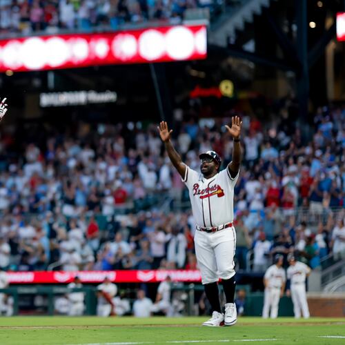 Atlanta Braves' Mike Yastrzemski (18) reacts with Braves third base coach Tommy Watkins (84) while rounding the bases after hitting a two-run home run against the Washington Nationals during the fifth inning of a baseball game, Thursday, July 30, 2026, in Atlanta. (AP Photo/Erik S. Lesser)