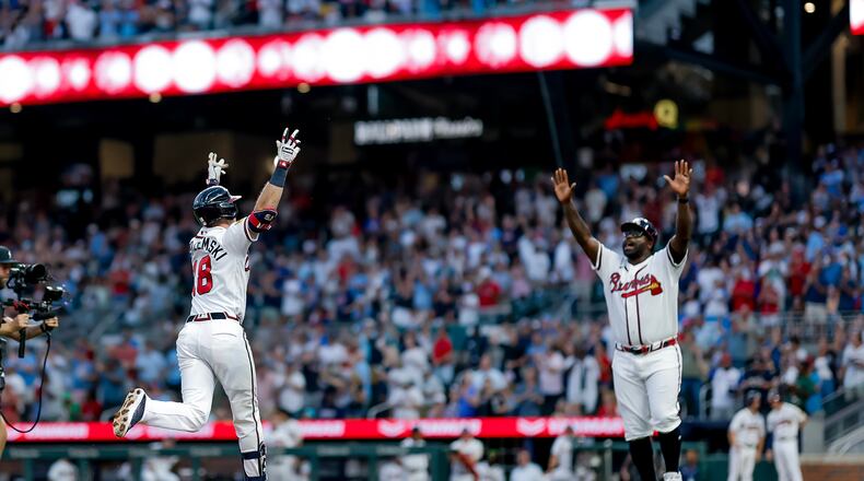 Atlanta Braves' Mike Yastrzemski (18) reacts with Braves third base coach Tommy Watkins (84) while rounding the bases after hitting a two-run home run against the Washington Nationals during the fifth inning of a baseball game, Thursday, July 30, 2026, in Atlanta. (AP Photo/Erik S. Lesser)