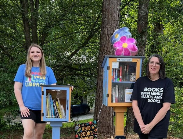 Alyssa Bickel (left) and Wendy Mizerek (right) created a Little Free Library corner in their neighborhood, complete with a painted rock garden, a trinket box for kids and a dog library. (Courtesy of Jamerson Forest's Fables)