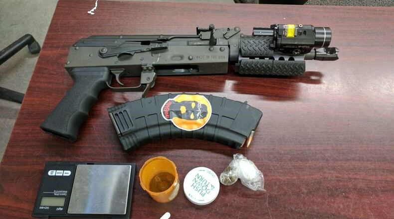 Three juveniles and five men were charged after seven firearms and drugs were recovered. (Credit: Atlanta Police Department)