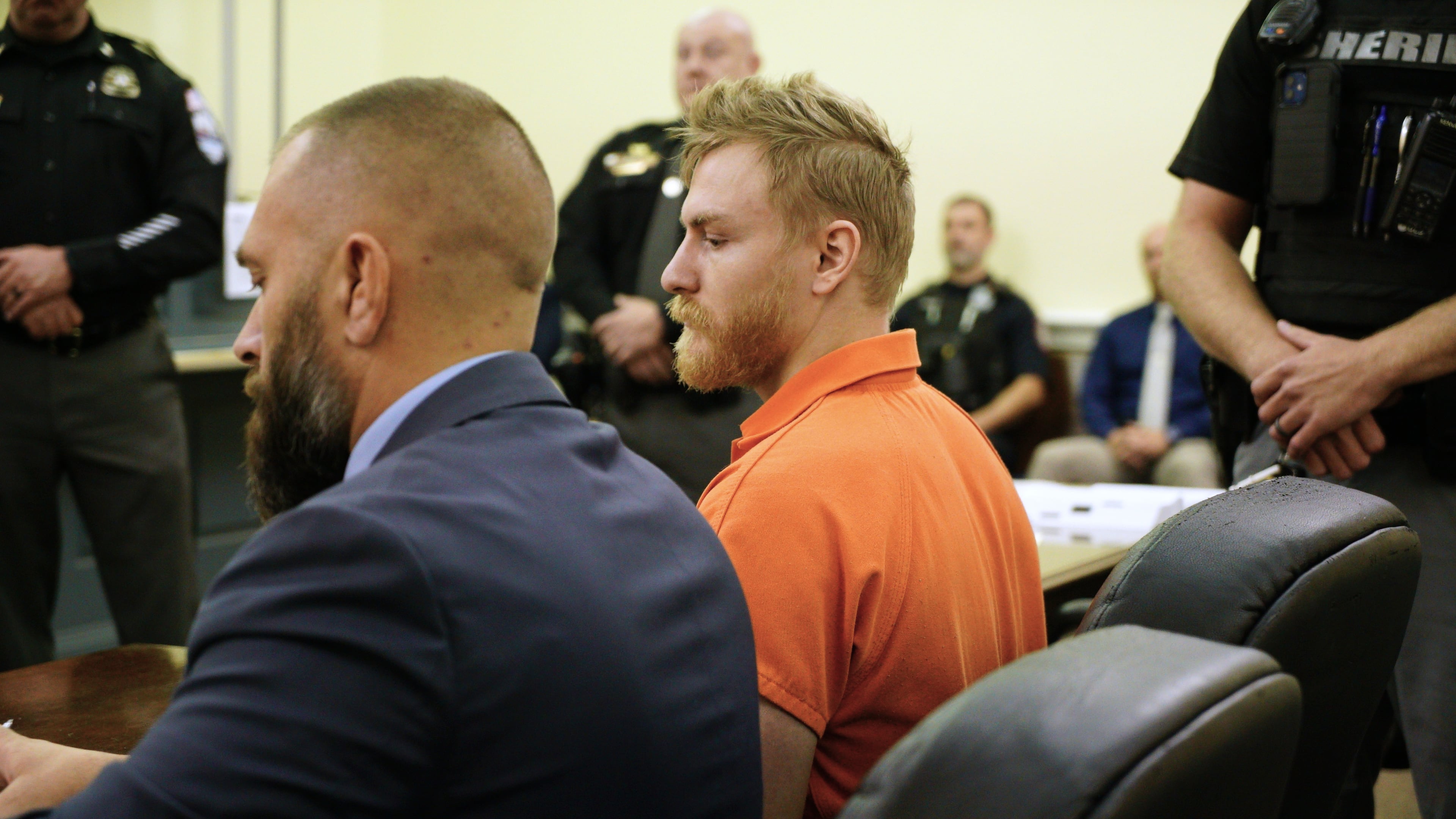 Shotsie Buck-Hayes sits beside defense attorney Edward Lavado in the General District Courtroom in during a preliminary hearing in Danville, Va., Tuesday, Sept. 30, 2025. He is charged with setting a city councilman on fire in July. (AP Photo/Allen G. Breed)