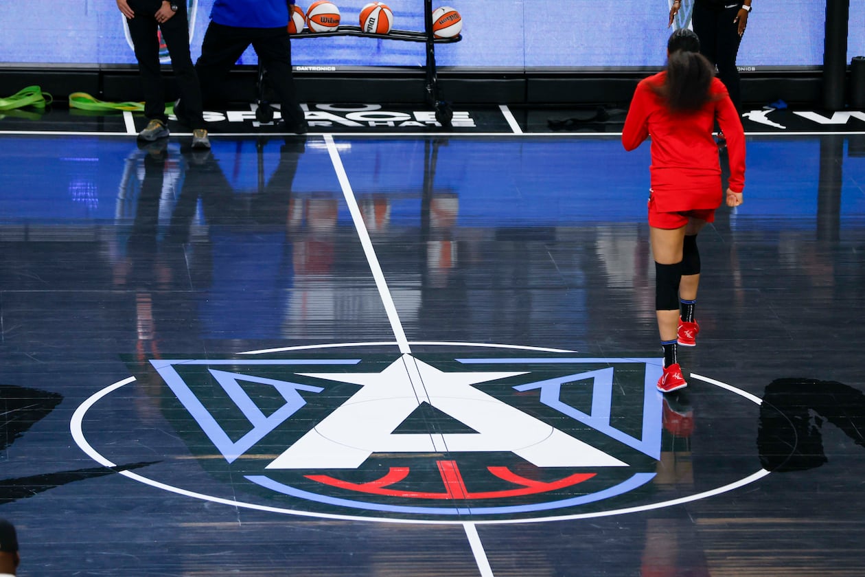 The Atlanta Dream logo is seen on display on the center court at the Gateway Center Arena before the first-round playoff game between the Atlanta Dream and the Indiana Fever on Sunday, Sept. 14, 2025, in Atlanta. (Miguel Martinez/AJC)