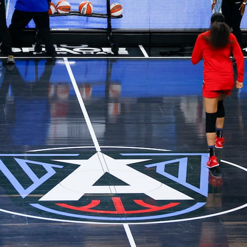 The Atlanta Dream logo is seen on display on the center court at the Gateway Center Arena before the first-round playoff game between the Atlanta Dream and the Indiana Fever on Sunday, Sept. 14, 2025, in Atlanta. (Miguel Martinez/AJC)