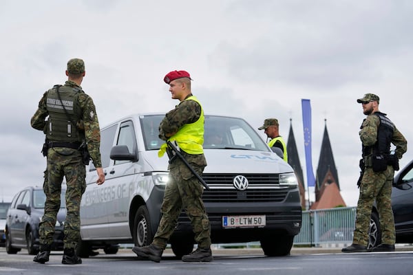 Polish border police check vehicles at a checkpoint bordering Germany, in Slubice, Poland, Monday, July 7, 2025. (AP Photo/Ebrahim Noroozi)