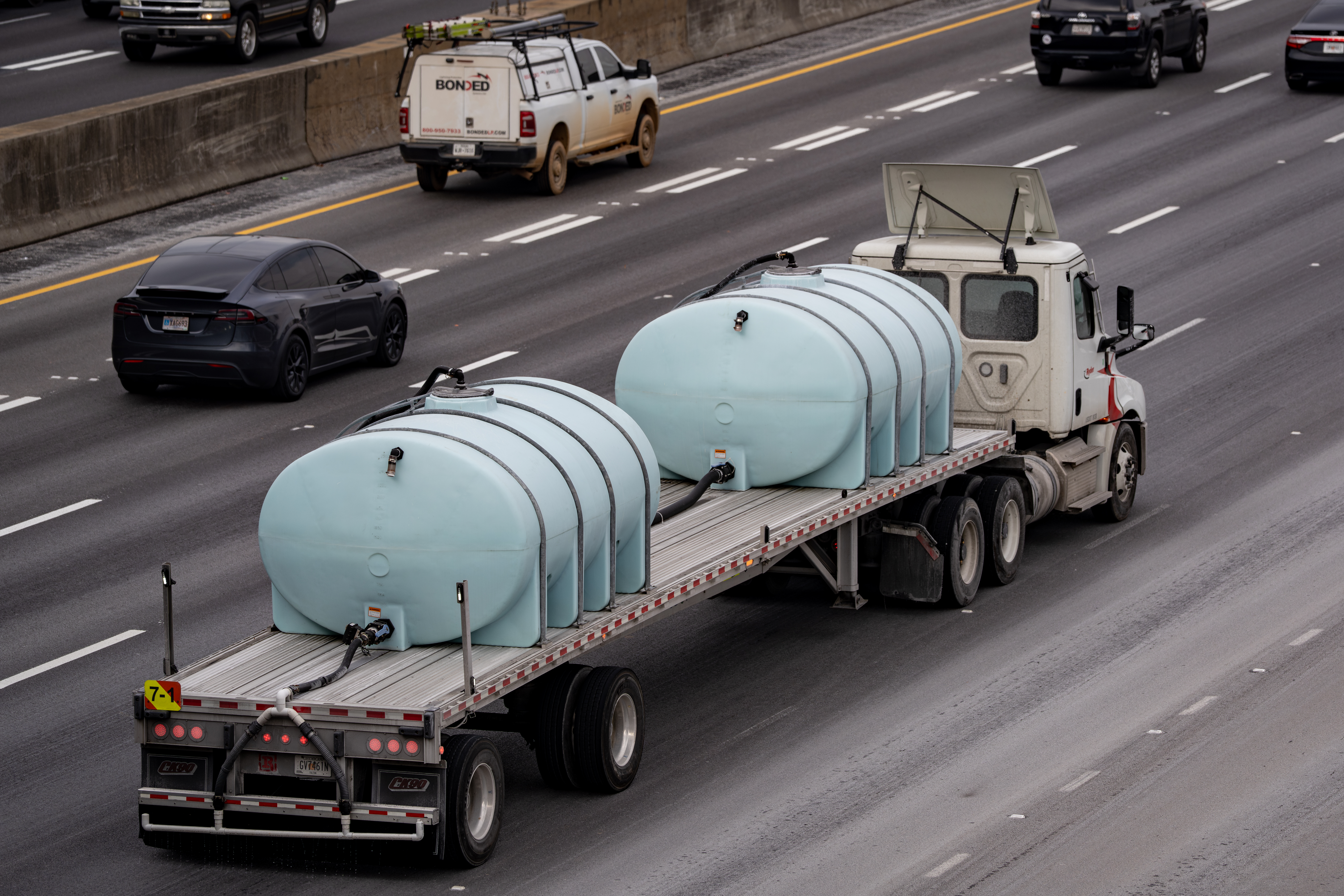 A convoy of Georgia Department of Transportation brine trucks treated roads in Atlanta on Friday, Jan. 20, 2026. (Ben Hendren for the AJC)