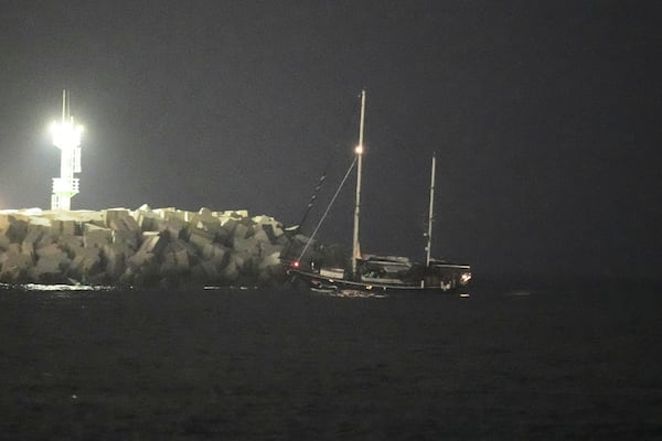 The Gaza-bound aid boat, Madleen, under escort of Israeli naval forces enters to Ashdod Port in southern Israel after being seized by Israeli forces, Monday, June 9, 2025. (AP Photo/Leo Correa)