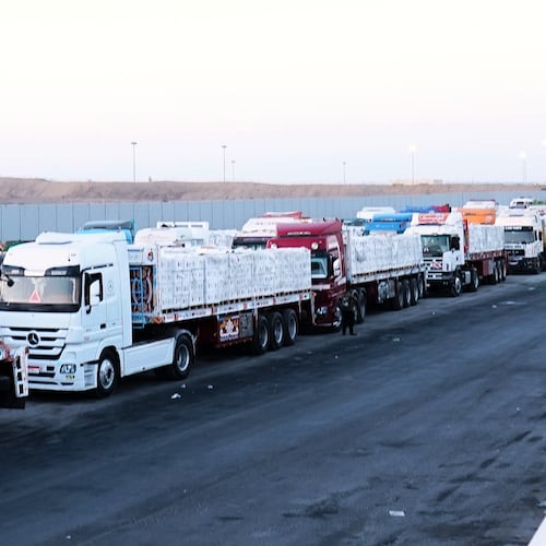 FILE -Trucks carrying humanitarian aids prepare to cross the Egyptian gate of the Rafah crossing, waiting for inspections by Israeli authorities before entering the Gaza Strip, following an agreement between Israel and Hamas on a ceasefire, Oct. 20, 2025. (AP Photo/Mohamed Arafat, File)
