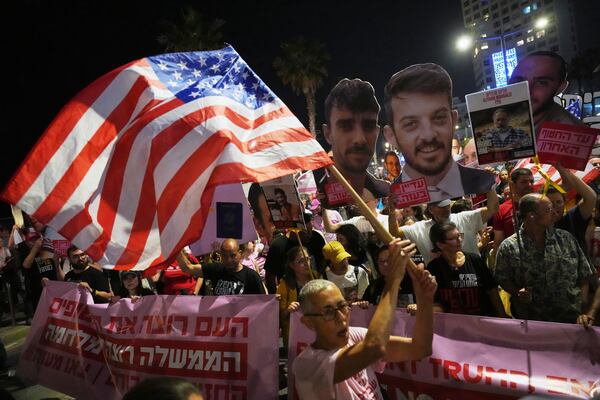 Israelis protest outside the U.S. Embassy Branch Office in Tel Aviv on Tuesday, May 13, 2025, demanding the release of hostages held by Hamas in the Gaza Strip. (AP Photo/Ariel Schalit)