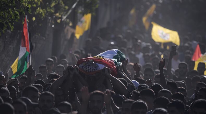 Mourners carry the body of Palestinian Imad Haroun Ishtayeh, 26, who was shot and killed by Israeli forces on Sunday at a concrete barrier separating the occupied West Bank from Jerusalem, during his funeral in the village of Salem, east of Nablus, Sunday, May 31, 2026. (AP Photo/Majdi Mohammed)