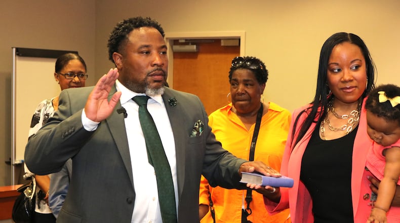 Devon Horton takes the oath of office at the DeKalb County Superior Courthouse in Decatur on Thursday, June 29, 2023. Members of his family, including his wife Christiane Horton, were in attendance at the private ceremony. Horton begins working as the superintendent of the DeKalb County School District on July 1. (Photo courtesy DeKalb County School District)