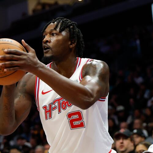 FILE - Houston Rockets forward Dorian Finney-Smith shoots against the Charlotte Hornets during the first half of an NBA basketball game in Charlotte, N.C., Feb. 19, 2026. (AP Photo/Nell Redmond, File)