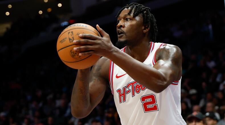 FILE - Houston Rockets forward Dorian Finney-Smith shoots against the Charlotte Hornets during the first half of an NBA basketball game in Charlotte, N.C., Feb. 19, 2026. (AP Photo/Nell Redmond, File)