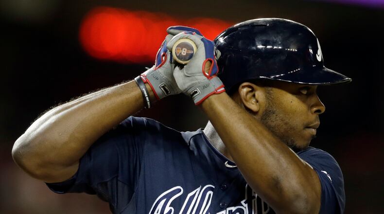 Atlanta Braves left fielder Justin Upton (8) bats during a baseball game against the Washington Nationals at Nationals Park Monday, Aug. 5, 2013, in Washington. The Braves won 3-2. (AP Photo/Alex Brandon)