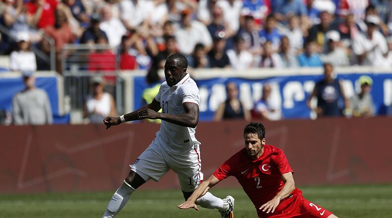 United States' Jozy Altidore (left) runs by Turkey's Hakan Kadir Balta in the second half of an international soccer friendly, Sunday, June 1, 2014, in Harrison, N.J. The U.S. won 2-1.