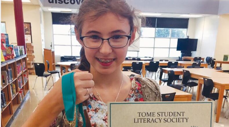 Woodstock Middle School student Abby Hallman won first place at the TomeCon annual statewide conference.