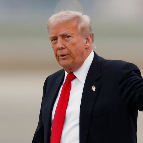 President Donald Trump waves after speaking to the media upon his arrival at Joint Base Andrews, Md., Sunday, Nov. 9, 2025, after returning from his Mar-a-Lago estate in Palm Beach, Fla. and en route to an NFL football game between the Washington Commanders and the Detroit Lions. (AP Photo/Luis M. Alvarez)