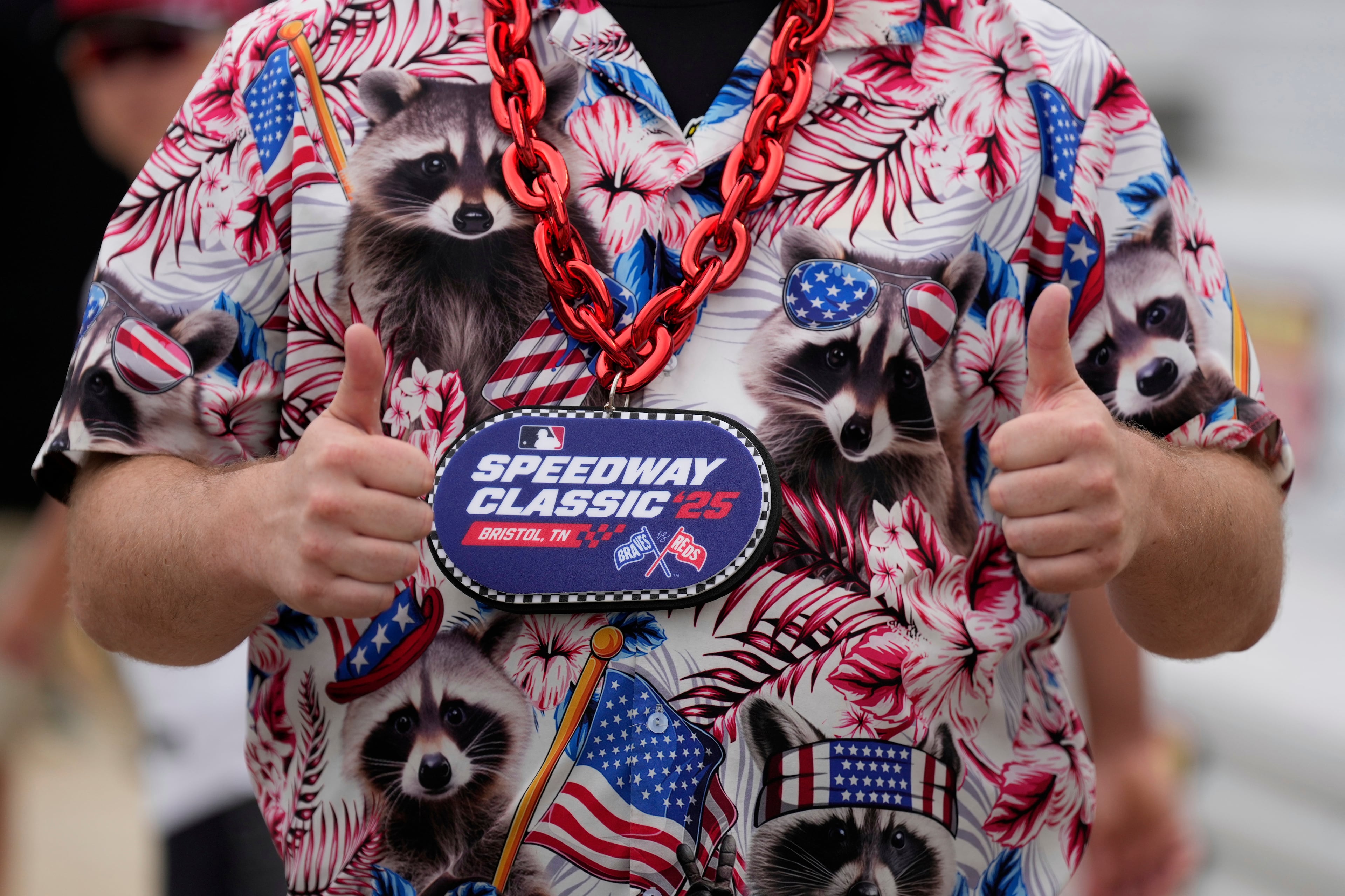 A baseball fans gives the all clear sign before the Speedway Classic in Bristol, Tennessee (Sunday's version).