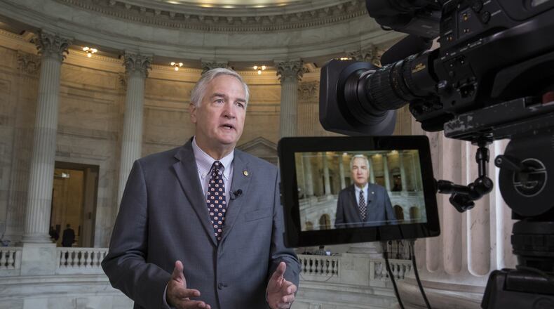 In this July 11, 2017 file photo, Sen. Luther Strange, R-Ala. responds to questions during a TV news interview on Capitol Hill in Washington. President Donald Trump has endorsed Strange in a special GOP primary election next week. (AP Photo/J. Scott Applewhite, File)