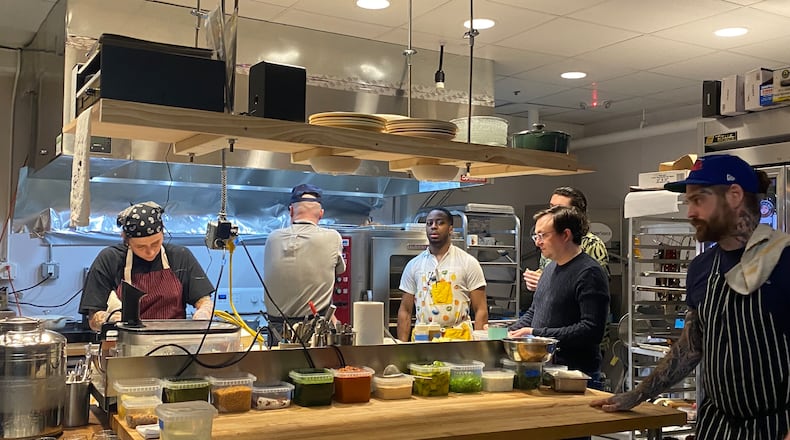 Counter seating at Bovino After Dark gives guests a close-up view of the kitchen and frequent interaction with its staff. Ligaya Figueras/lfigueras@ajc.com
