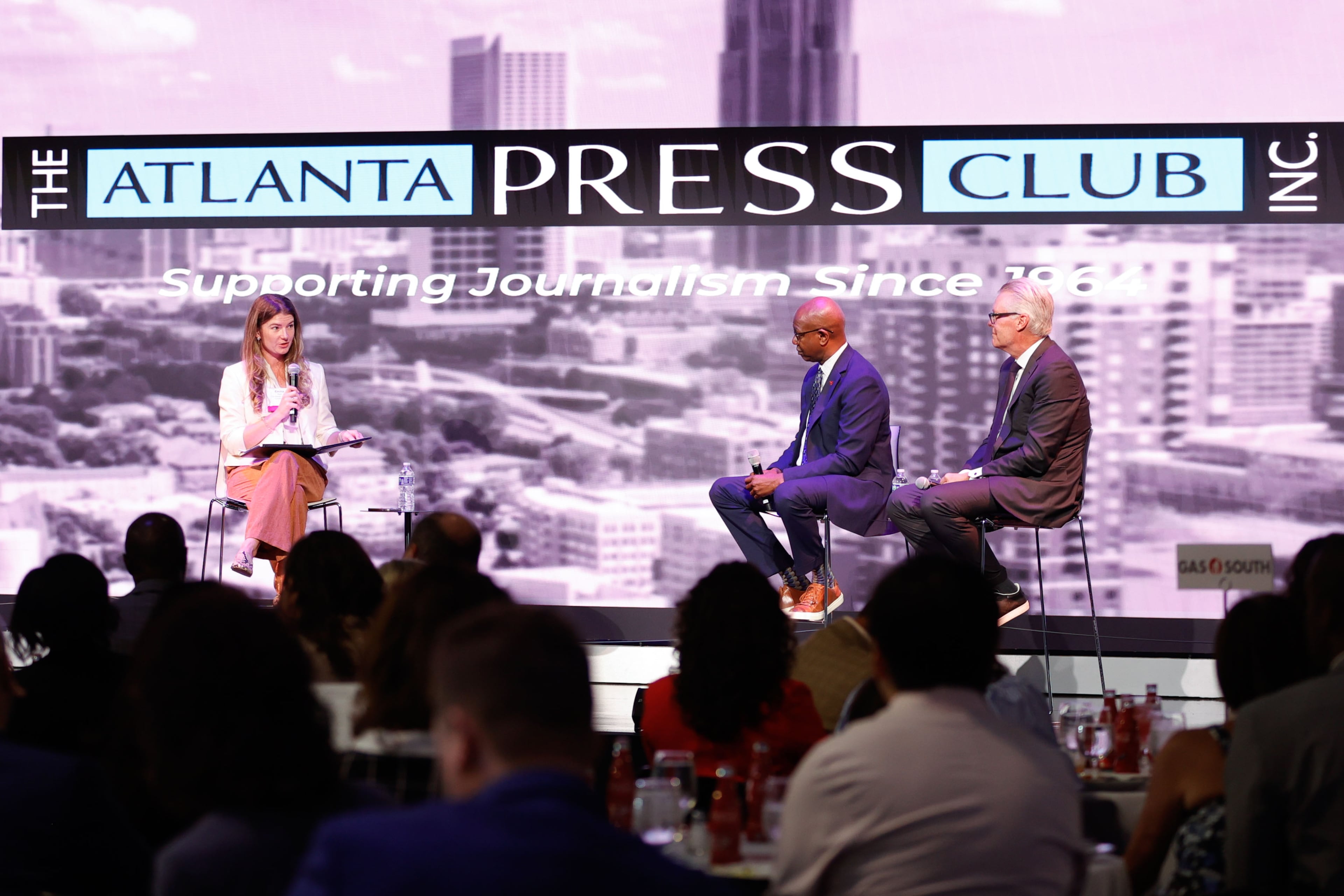 AJC reporter Emma Hurt (from left) moderates a conversation with Ricky Smith, general manager of Hartsfield-Jackson Atlanta International Airport, and Ed Bastian, CEO of Delta Air Lines, at the Delta Flight Museum on Tuesday, Sept. 9, 2025. More than 17% of Delta passengers take off or land in Atlanta. (Natrice Miller/AJC)