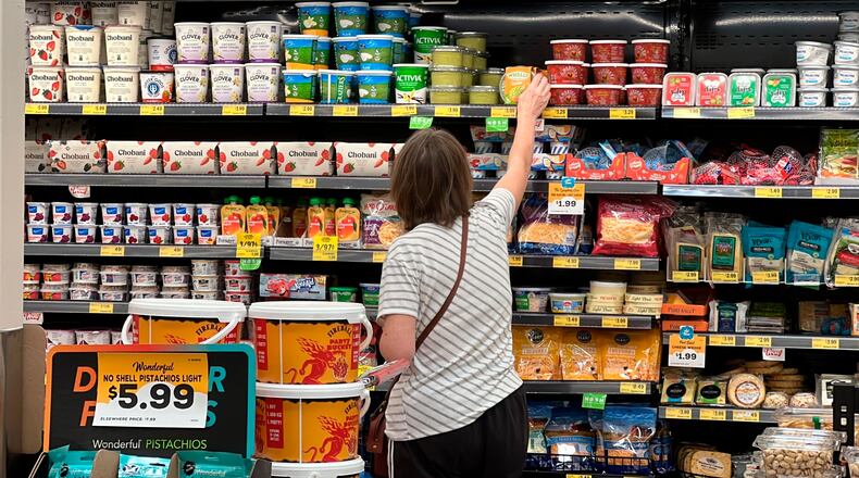 FILE - A customer looks at items at a Grocery Outlet store in Pleasanton, Calif.,. on Sept. 15, 2022. (AP Photo/Terry Chea, File)