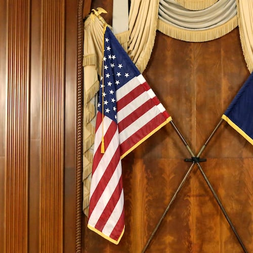 FILE - The U.S. and South Carolina flags hang in the South Carolina statehouse, March 16, 2021, in Columbia, S.C . (AP Photo/Jeffrey Collins, File)