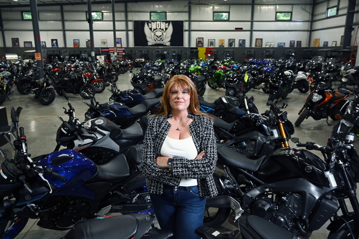Candy Hunter stands inside WOW Motorcycles on Thursday, July 24, 2025, in Marietta. Hunter started as a receptionist in 1992. Now, she is the owner and CEO. (Hyosub Shin/AJC)