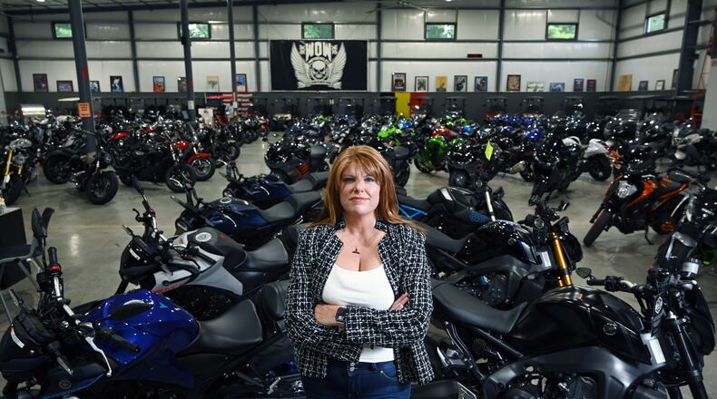 Candy Hunter stands inside WOW Motorcycles on Thursday, July 24, 2025, in Marietta. Hunter started as a receptionist in 1992. Now, she is the owner and CEO. (Hyosub Shin/AJC)