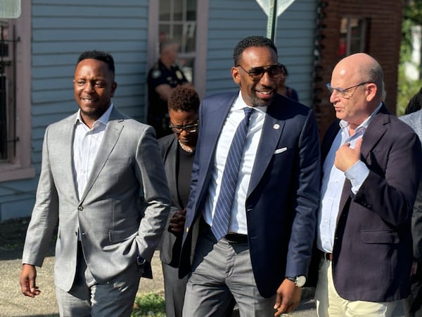 Atlanta Mayor Andre Dickens (center) tours the Vine City neighborhood in September 2024 with his senior adviser, Courtney English (left), and Westside Future Fund CEO and president John Ahmann (right). (Matt Reynolds/AJC 2024)