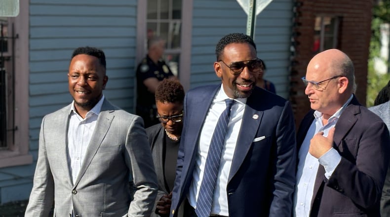 Mayor Andre Dickens (center) walks the Vine City neighborhood on Monday, Sept. 16, 2024 with his senior advisor Courtney English (left) and Westside Future Fund CEO and president John Ahmann (right). (Matt Reynolds/AJC)